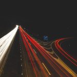 Highway at night with vehicle light trails