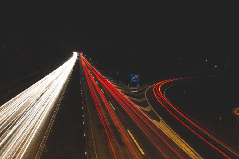 Highway at night with vehicle light trails