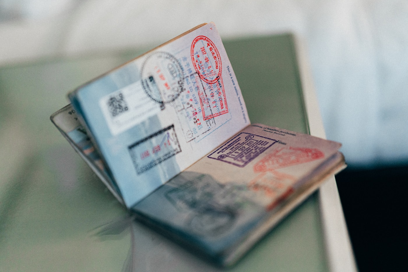 An open passport showing multiple entry and exit stamps